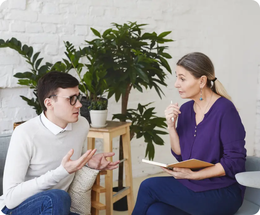 Therapist discussing with a patient